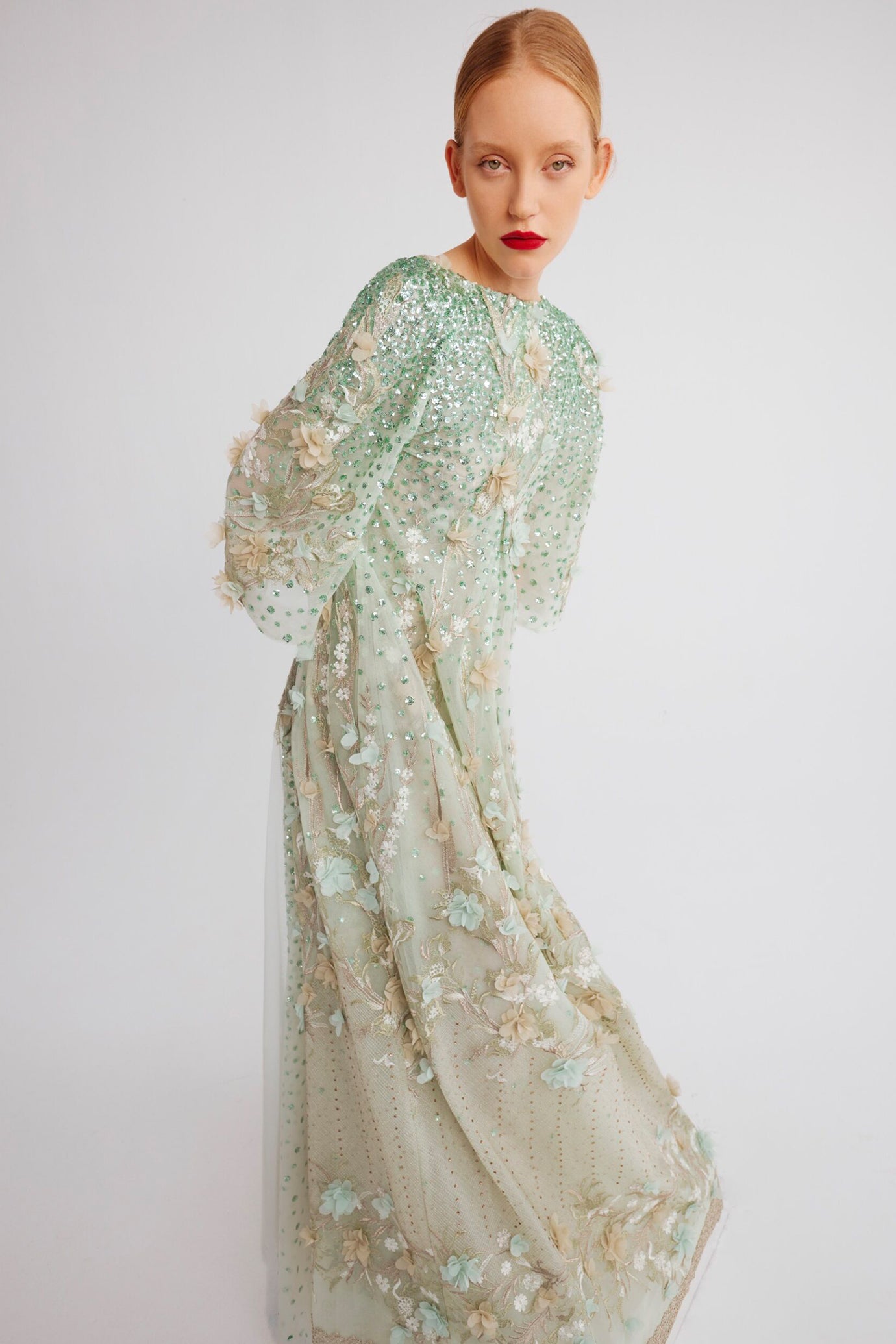 V-Neck Dress with Cape Sleeves and Floral Embellishments